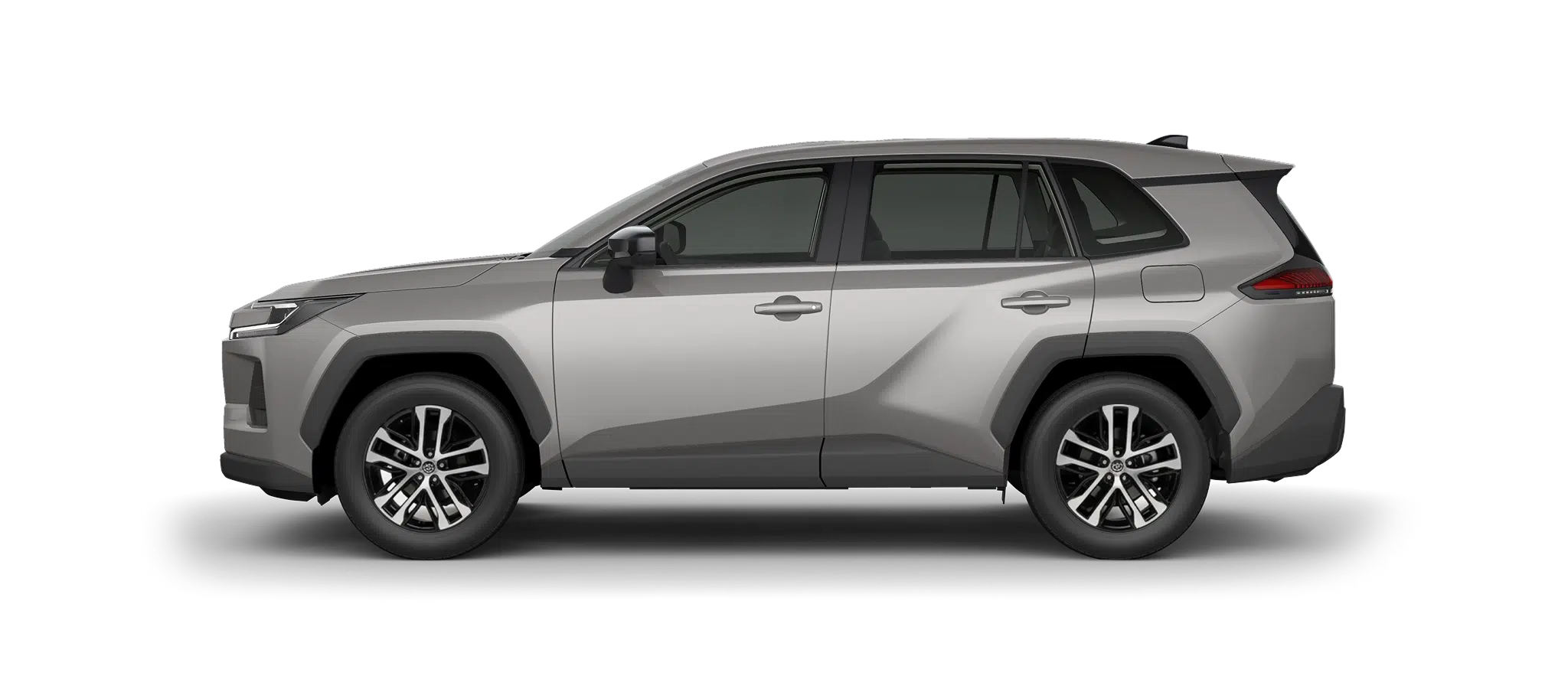 Side view of a silver mid-size SUV with black wheel arches and alloy wheels against a dark background.